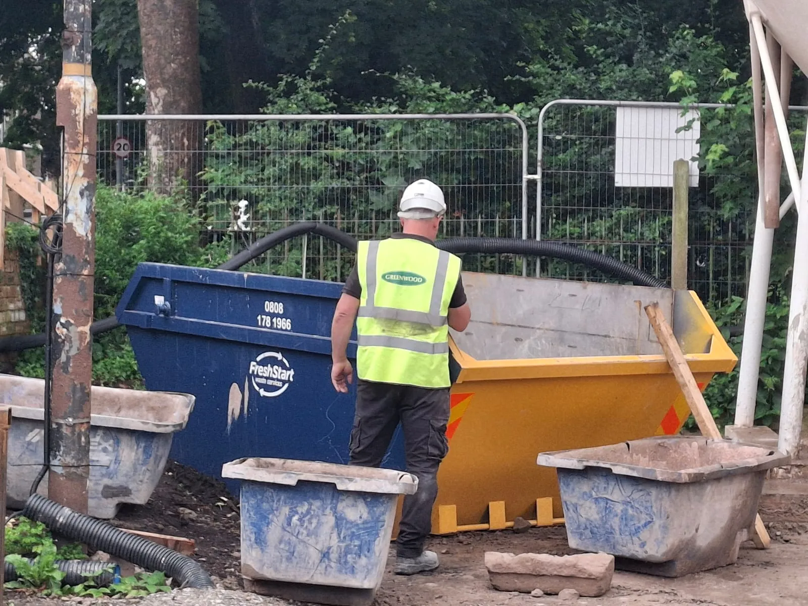 Fresh Start Waste skips with a worker